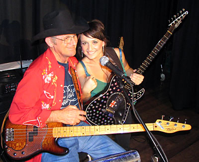 Allan Tomkins presents Kirsty Lee Akers with a new guitar